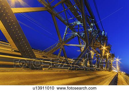 Stock Image - Ukraine, Dnepropetrovsk region, Dnepropetrovsk city, Illuminated bridge at night. Fotosearch