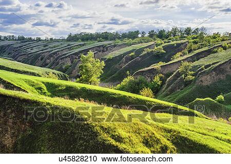 Ukraine, Dnepropetrovsk region, Dnepropetrovsk city, Green landscape formed by geological erosion View Large Photo Image Stock Image - Ukraine, Dnepropetrovsk region, Dnepropetrovsk city, Green landscape formed by geological erosion. Fotosearch