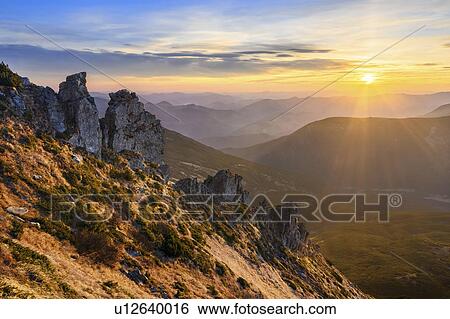 Stock Photograph - Ukraine, Ivano-Frankivsk region, Verkhovyna district, Carpathians, Chornohora, Sunrise over mountain Shpytsi. Fotosearch
