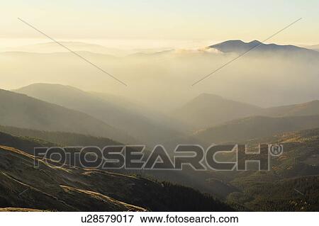 Ukraine, Zakarpattia region, Rakhiv district, Carpathians, Chornohora, Mountain landscape with mist View Large Photo Image Stock Photo - Ukraine, Zakarpattia region, Rakhiv district, Carpathians, Chornohora, Mountain landscape with mist. Fotosearch