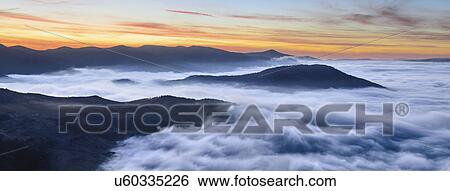 Ukraine, Zakarpattia region, Rakhiv district, Carpathians, Chornohora, Sheshul, Mist over mountains at dawn View Large Photo Image Stock Photograph - Ukraine, Zakarpattia region, Rakhiv district, Carpathians, Chornohora, Sheshul, Mist over mountains at dawn. Fotosearch