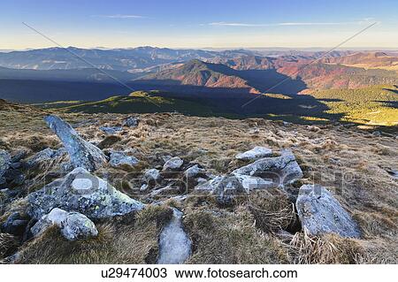 Stock Image - Ukraine, Zakarpattia region, Carpathians, Chornohora, mountain Hoverla, Blue sky over mountain range. Fotosearch