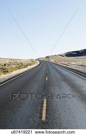 USA, Nevada, Highway 50, Blue sky over empty road View Large Photo Image Stock Image - USA, Nevada, Highway 50, Blue sky over empty road. Fotosearch