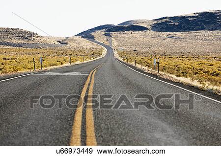 USA, Nevada, Highway 50, Empty road through field View Large Photo Image Stock Photo - USA, Nevada, Highway 50, Empty road through field. Fotosearch