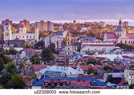 Stock Image - Vilnius, Lithuania, Cityscape at sunrise. Fotosearch
