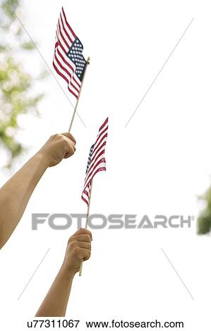 American flags holds by boy (6-7) and girl (4-5) View Large Photo Image Stock Photo - American flags holds by boy (6-7) and girl (4-5). Fotosearch