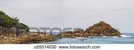 Stock Image - Australia, New South Wales, Rocky seashore at Mimosa Rocks National Park. Fotosearch