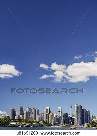 Stock Image - Australia, New South Wales, Sydney, City skyline on sunny day. Fotosearch