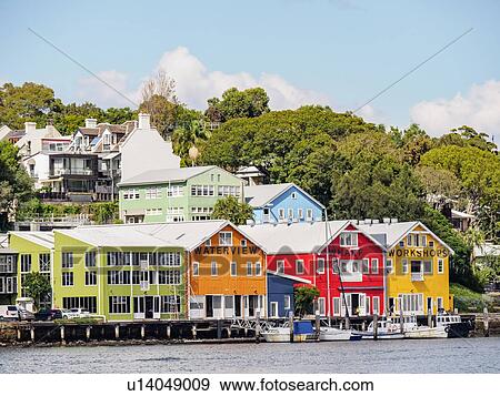 Stock Photo - Australia, New South Wales, Sydney, Colorful houses near water. Fotosearch