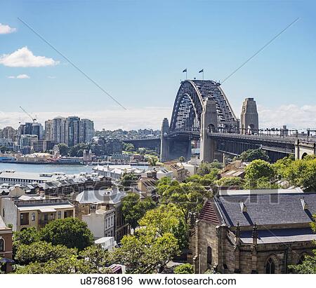 Stock Photograph - Australia, New South Wales, Sydney, Cityscape and bridge over harbor. Fotosearch