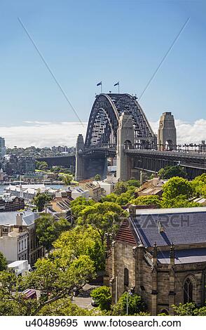 Stock Photography - Australia, New South Wales, Sydney, Cityscape and bridge over harbor. Fotosearch