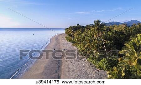 Stock Photography - Australia, Queensland, Blue sky over coastline. Fotosearch