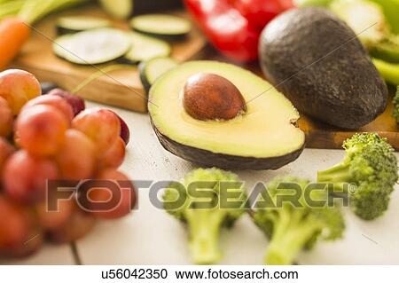 Avocado surrounded by various fruits and vegetables View Large Photo Image Stock Image - Avocado surrounded by various fruits and vegetables. Fotosearch