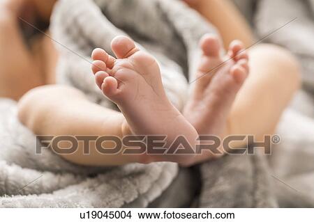 Picture - Baby boy's (0-1 months) feet. Fotosearch