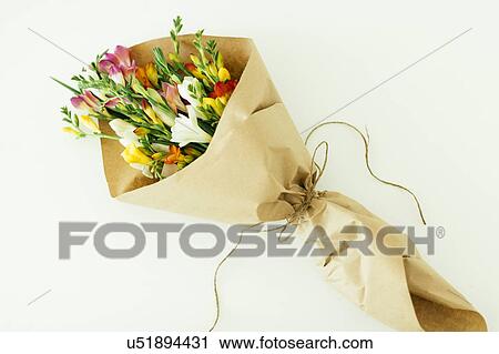 Stock Image - Bouquet wrapped in paper. Fotosearch