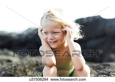 Boy (4-5) playing on rocks View Large Photo Image Picture - Boy (4-5) playing on rocks. Fotosearch