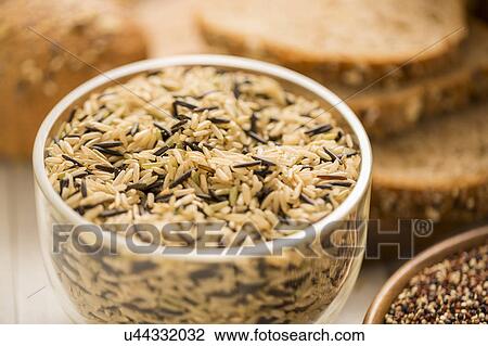 Brown and black rice in bowl View Large Photo Image Stock Image - Brown and black rice in bowl. Fotosearch