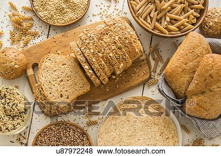Brown bread on cutting board View Large Photo Image Stock Photo - Brown bread on cutting board. Fotosearch