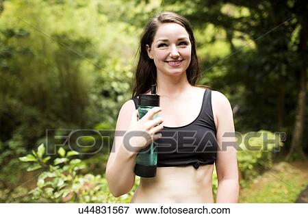 Caribbean Islands, Saint Lucia, woman with bottle of water View Large Photo Image Stock Photo - Caribbean Islands, Saint Lucia, woman with bottle of water. Fotosearch