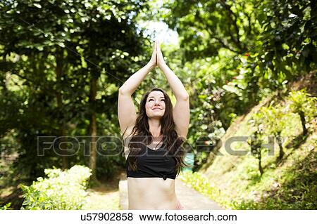 Caribbean Islands, Saint Lucia, woman doing yoga exercises in open air View Large Photo Image Stock Photo - Caribbean Islands, Saint Lucia, woman doing yoga exercises in open air. Fotosearch