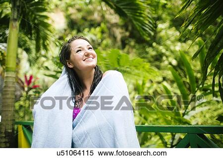 Caribbean Islands, Saint Lucia, Woman with wet hair wrapped in towel with lush foliage in background View Large Photo Image Stock Photography - Caribbean Islands, Saint Lucia, Woman with wet hair wrapped in towel with lush foliage in background. Fotosearch