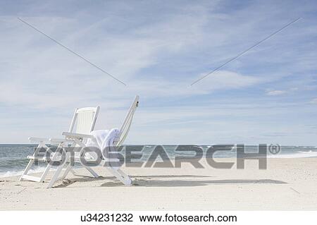 Chairs on beach after sunrise View Large Photo Image Stock Image - Chairs on beach after sunrise. Fotosearch