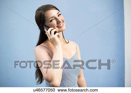 Cheerful woman during phone conversation View Large Photo Image Stock Image - Cheerful woman during phone conversation. Fotosearch
