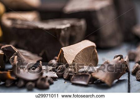 Close-up of chocolate pieces View Large Photo Image Stock Image - Close-up of chocolate pieces. Fotosearch