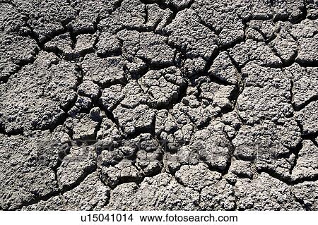 Picture - Close up of cracked dry ground. Fotosearch