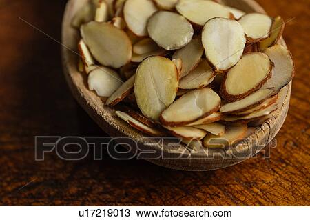 Close-up of wooden spoon full of sliced almonds on table View Large Photo Image Stock Image - Close-up of wooden spoon full of sliced almonds on table. Fotosearch
