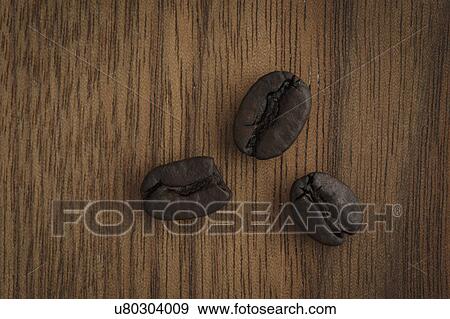 Stock Photo - Coffee beans on table. Fotosearch