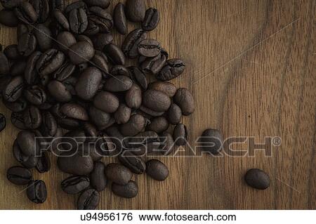 Stock Photograph - Coffee beans on table. Fotosearch