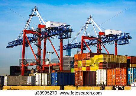 Cranes and cargo containers in dock View Large Photo Image Stock Image - Cranes and cargo containers in dock. Fotosearch
