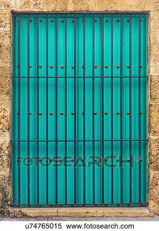 Stock Photography - Cuba, Havana, Building exterior with turquoise shutters. Fotosearch