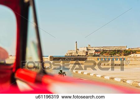 Cuba, Havana, Fort with lighthouse seen from convertible View Large Photo Image Stock Photo - Cuba, Havana, Fort with lighthouse seen from convertible. Fotosearch