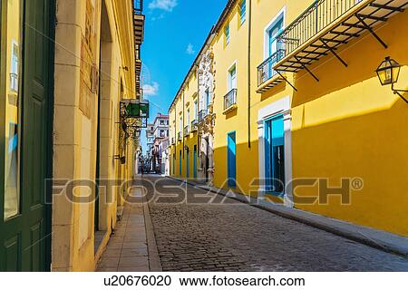 Cuba, Havana, Street with yellow houses View Large Photo Image Stock Image - Cuba, Havana, Street with yellow houses. Fotosearch