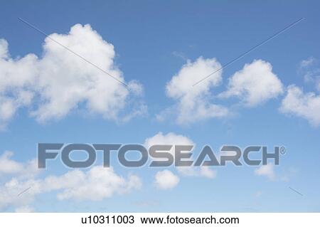 Stock Image - Cumulus clouds on blue sky. Fotosearch