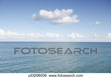 Stock Photo - Cumulus clouds over Atlantic Ocean. Fotosearch
