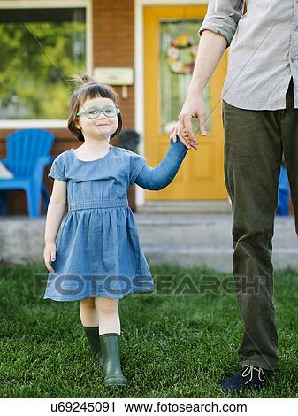 Daughter (2-3) walking with father View Large Photo Image Stock Image - Daughter (2-3) walking with father. Fotosearch