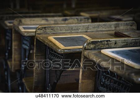 Stock Image - Desks in old school. Fotosearch
