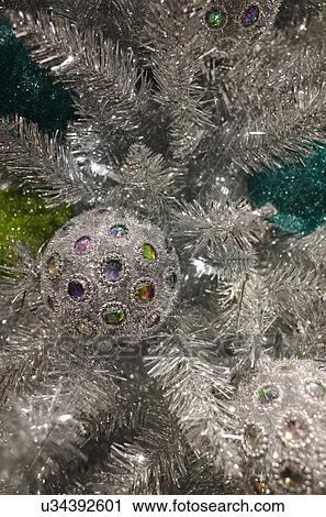 Stock Image - Detail of Christmas tree with decorations. Fotosearch