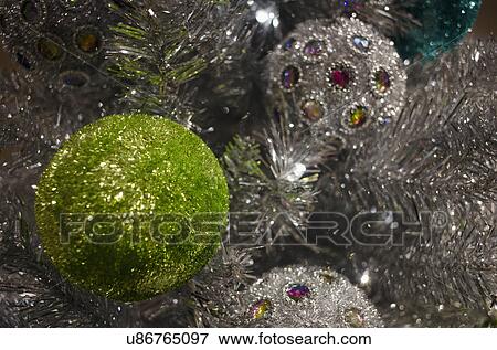 Stock Photo - Detail of Christmas tree with decorations. Fotosearch