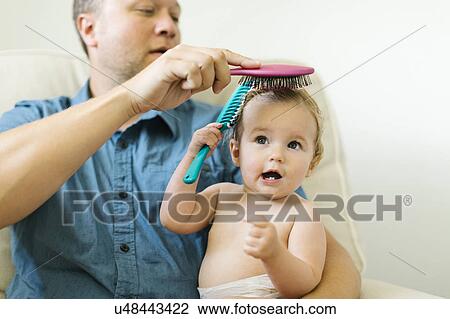Father and baby girl (12-17 months) brushing hair after bath View Large Photo Image Stock Image - Father and baby girl (12-17 months) brushing hair after bath. Fotosearch