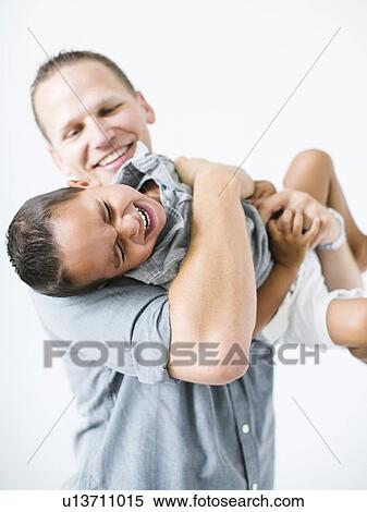 Father holding son (2-3) and laughing View Large Photo Image Stock Photography - Father holding son (2-3) and laughing. Fotosearch