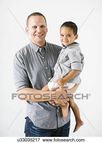 Stock Photo - Father holding son (2-3). Fotosearch