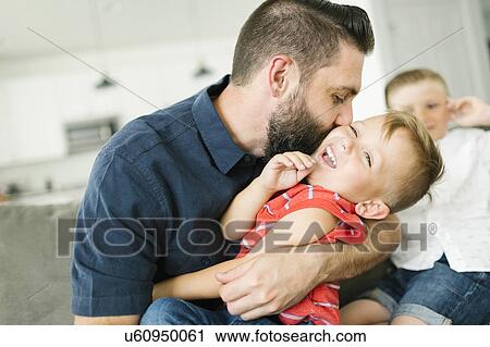 Father kissing son (2-3) on cheek View Large Photo Image Stock Image - Father kissing son (2-3) on cheek. Fotosearch