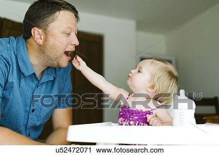 Father playing with baby girl (12-17 months) View Large Photo Image Stock Image - Father playing with baby girl (12-17 months). Fotosearch