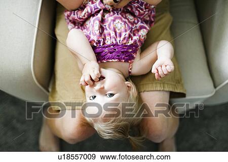 Father playing with baby girl (12-17 months) View Large Photo Image Stock Photo - Father playing with baby girl (12-17 months). Fotosearch