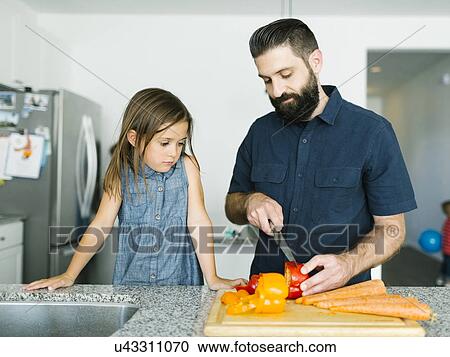 Father with daughter (6-7) cooking together View Large Photo Image Stock Image - Father with daughter (6-7) cooking together. Fotosearch