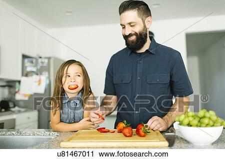 Father with daughter (6-7) eating strawberries View Large Photo Image Stock Image - Father with daughter (6-7) eating strawberries. Fotosearch